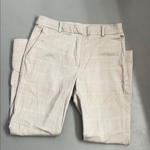 Grey slacks with white stripes